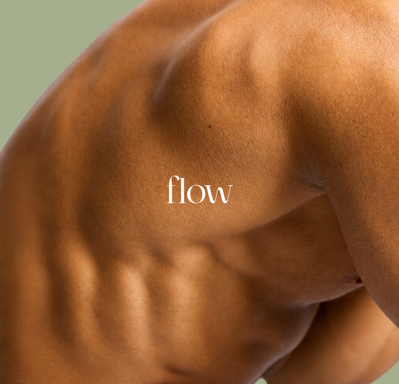 Close-up of dark brown skin with warm sculptural shadows and the white word “flow” centered over it.